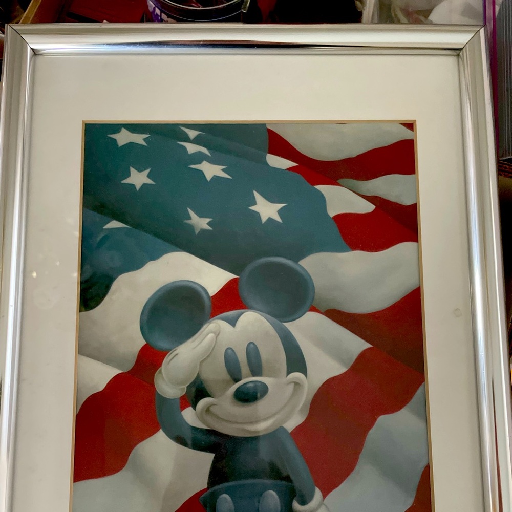 This is a great picture of All American Mickey saluting our US Flag.